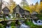 Old small wooden water mills called Mlincici built on Pliva lake near Jajce, BosniaÂ and Herzegovina